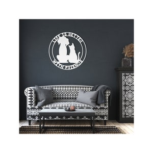 May include: White metal wall decor with a dog and cat silhouette inside a circle. The text reads "Life is better with friends".