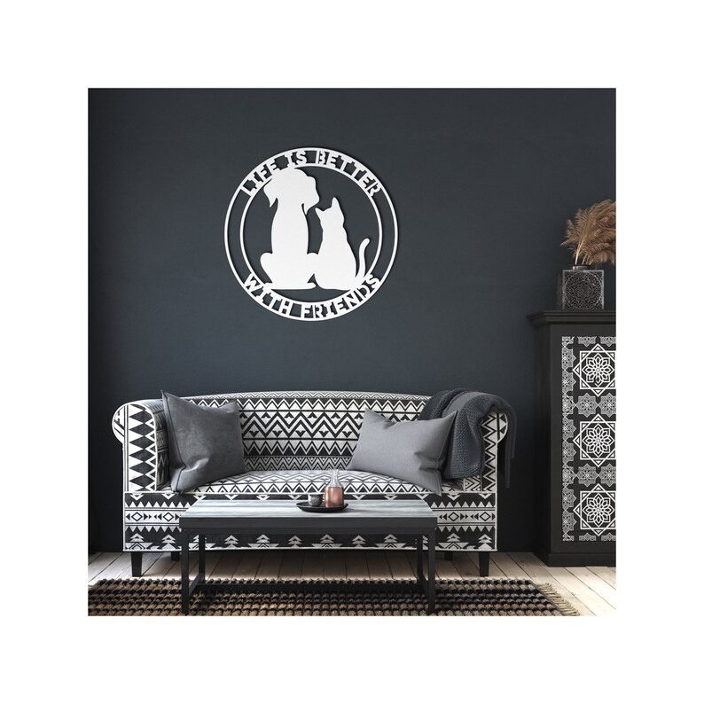 May include: White metal wall decor with a dog and cat silhouette inside a circle. The text reads "Life is better with friends".