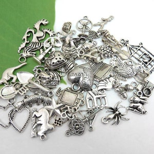 Grab bag, lot of 50 mixed charms, antique silver collection