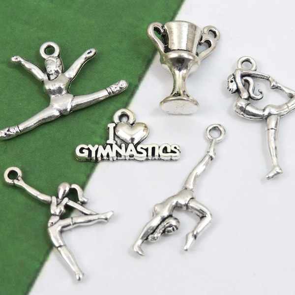 6 gymnastic charms, antique silver sports charm collection