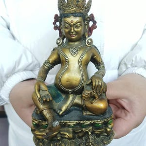 Vintage Yellow Jambhala Buddha Statue Tibetan Buddhism Tantric God of Wealth Deity  Bodhisattva Hindu Praying Meditation buddhist blessings.