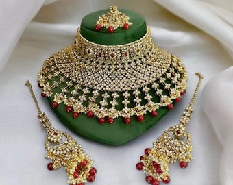 Ruby green kundan heavy bridal necklace set with jhumka earring, tika and kanser