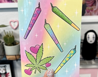 May include: A sheet of colorful stickers featuring cartoon images of joints with glitter and hearts. The stickers are on a rainbow background.