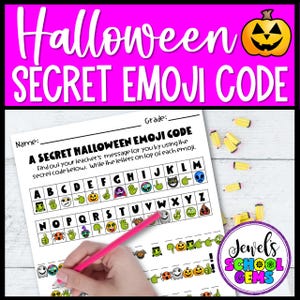 May include: A Halloween-themed worksheet with the text "Halloween SECRET EMOJI CODE" in a pink banner. The worksheet has an emoji code with letters and emojis. A hand holds a pink pencil, ready to write. Yellow pencils are scattered around.