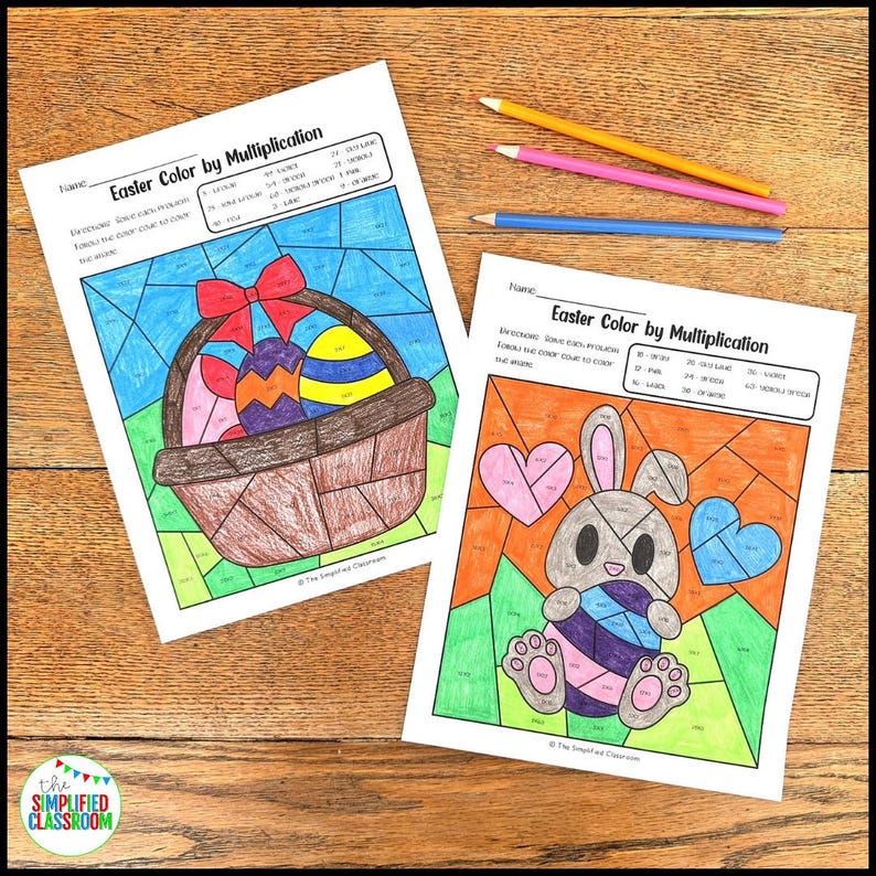 May include: Two Easter-themed color-by-multiplication worksheets with a basket of eggs and a bunny, along with three colored pencils. The worksheets are titled "Easter Color by Multiplication". The Simplified Classroom logo is in the bottom left corner.