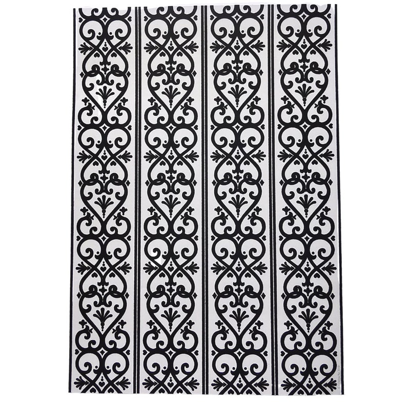 May include: Black and white patterned fabric with a repeating design of stylized hearts and swirls.