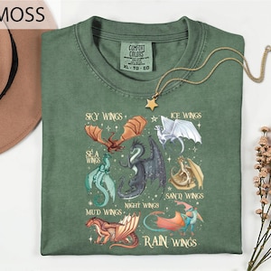 a green t-shirt with a graphic design of various dragon illustrations, including a red dragon, a blue dragon, and a white dragon, along with the text "MOSS" and "COMFORT COLLECTibles" printed on it.