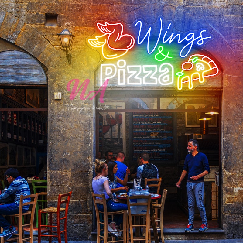 Exterior of a popular Omaha wing restaurant with neon lights