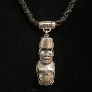 Moai. Handmade silver pendant with Easter Island statues on a jewelry thread