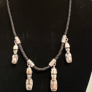 Moai. Handmade silver pendant with Easter Island 4 statues on a jewelry thread