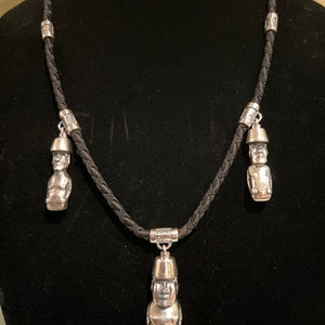 Moai. Handmade silver pendant with Easter Island 3 statues on a jewelry thread