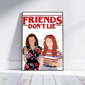May include: A framed art print featuring two figures with the text "FRIENDS DON'T LIE" in red. One figure wears a patterned dress, the other a striped shirt. Both hold drinks. The artwork is set against a white background.
