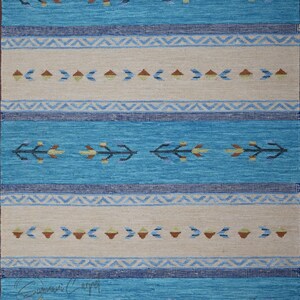 Handwoven kilim rug in blue and beige, flatweave wool with geometric tribal motifs and borders