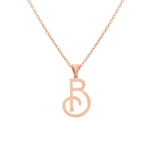 May include: A rose gold necklace with a delicate pendant featuring the letter "B" in a stylized, open-circle design.