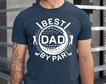 May include: A navy blue t-shirt with a white graphic of a golf ball with the text "Best Dad By Par" around it.