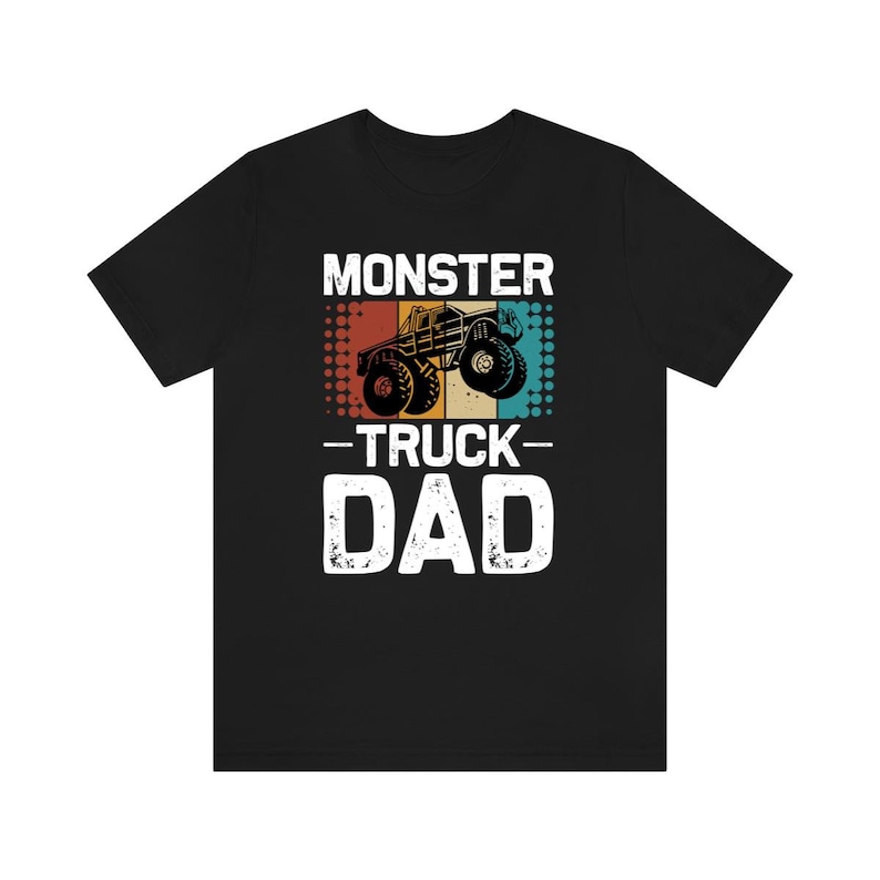 May include: Black t-shirt with a vintage-style graphic of a monster truck and the text "Monster Truck Dad".