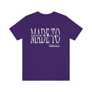 May include: Purple t-shirt with white text that reads "MADE TO worship MADE TO" and "Psalm 95:1".