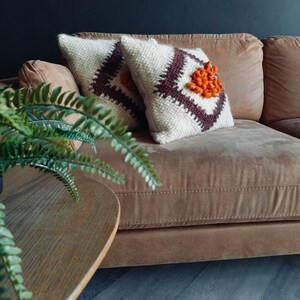 Rustic farmhouse throw pillow, evoking a sense of comfort and nostalgia with its charming design