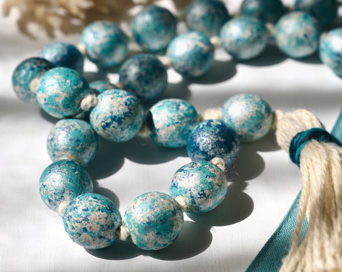 Turquoise Coastal Farmhouse Bead Garland: Handmade Rustic Accent for Beachy Home Decor - Charming Tassel Detailing complements Coastal Vibes