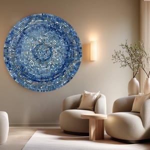 May include: A large circular wall art piece featuring a mosaic pattern of small square tiles in various shades of blue, ranging from deep navy to light sky blue, arranged in concentric circles that radiate from a central point.