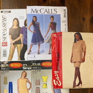 May include: Three sewing patterns for clothing. The first pattern is for a dress with a floral print and a yellow top. The second pattern is for a dress with a blue top and a floral skirt. The third pattern is for a dress with a brown top and a brown skirt. The patterns are all from McCall's.