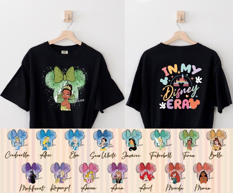 Puede incluir: Camiseta negra con un gr&aacute;fico de una princesa de Disney en una silueta de oreja de Mickey Mouse. La parte posterior de la camiseta tiene el texto "IN MY Disney ERA" con un castillo arco&iacute;ris y orejas de Mickey Mouse. Hay 10 opciones diferentes de princesas para elegir.