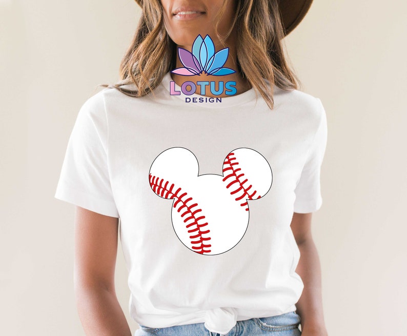 May include: White t-shirt with a red and white baseball Mickey Mouse design. The shirt has the text "LOTUS DESIGN" on the front.