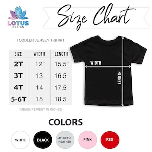 May include: Size chart for toddler jersey t-shirts.  Sizes 2T, 3T, 4T, and 5-6T with corresponding width and length measurements in inches.  Color options include white, black, athletic heather, pink, and red.
