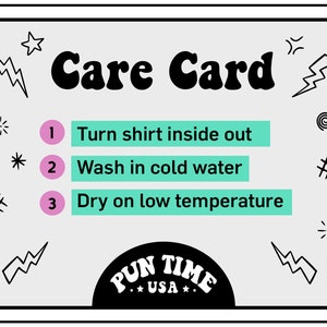 May include: A white care card with black text and graphics. The card has a title that says "Care Card" and three instructions: "Turn shirt inside out", "Wash in cold water", and "Dry on low temperature". The card also has a black circle with the text "PUN TIME *USA*" in white.