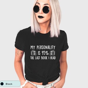 May include: Black t-shirt with white text that reads "My personality is 95% the last book I read".