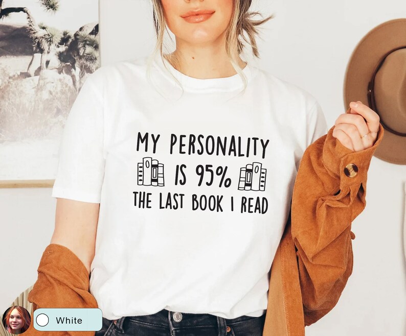 May include: White t-shirt with the text "My personality is 95% the last book I read" and a graphic of a stack of books.