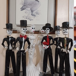 Bride and groom paper mache couple