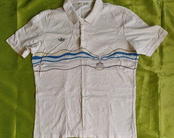 Adidas Ivan Lendl Dakota la cara hecha en Alemania Occidental vintage 80s hombres unisex polo camiseta blanca azul tamaño L, D 52, F 5