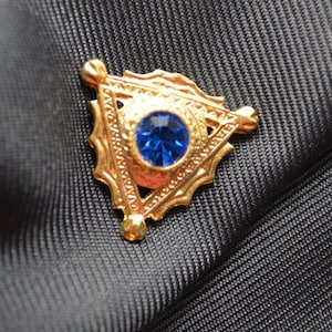 Triangular Matte Gold with Capri Blue stone Button (E-02)