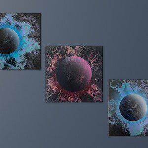 May include: Three abstract paintings on canvas with a black background and a large, dark grey circle in the centre of each. The circle is surrounded by a colourful, swirling pattern of blue, pink, and purple.