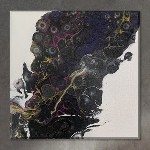 May include: Abstract acrylic painting on canvas. The artwork features a dark, swirling design with black, purple, yellow, and pink hues against a white background. The fluid art style creates a unique and textured appearance.