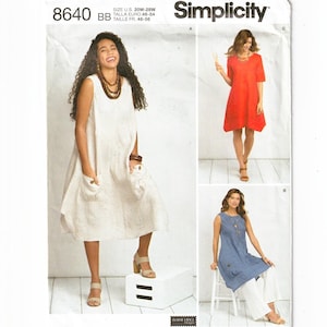 May include: Simplicity sewing pattern 8640 for sizes 20W-28W. The envelope displays three dress variations: a sleeveless beige dress with patch pockets, a short-sleeved red dress, and a sleeveless blue tunic worn over white wide-leg trousers.