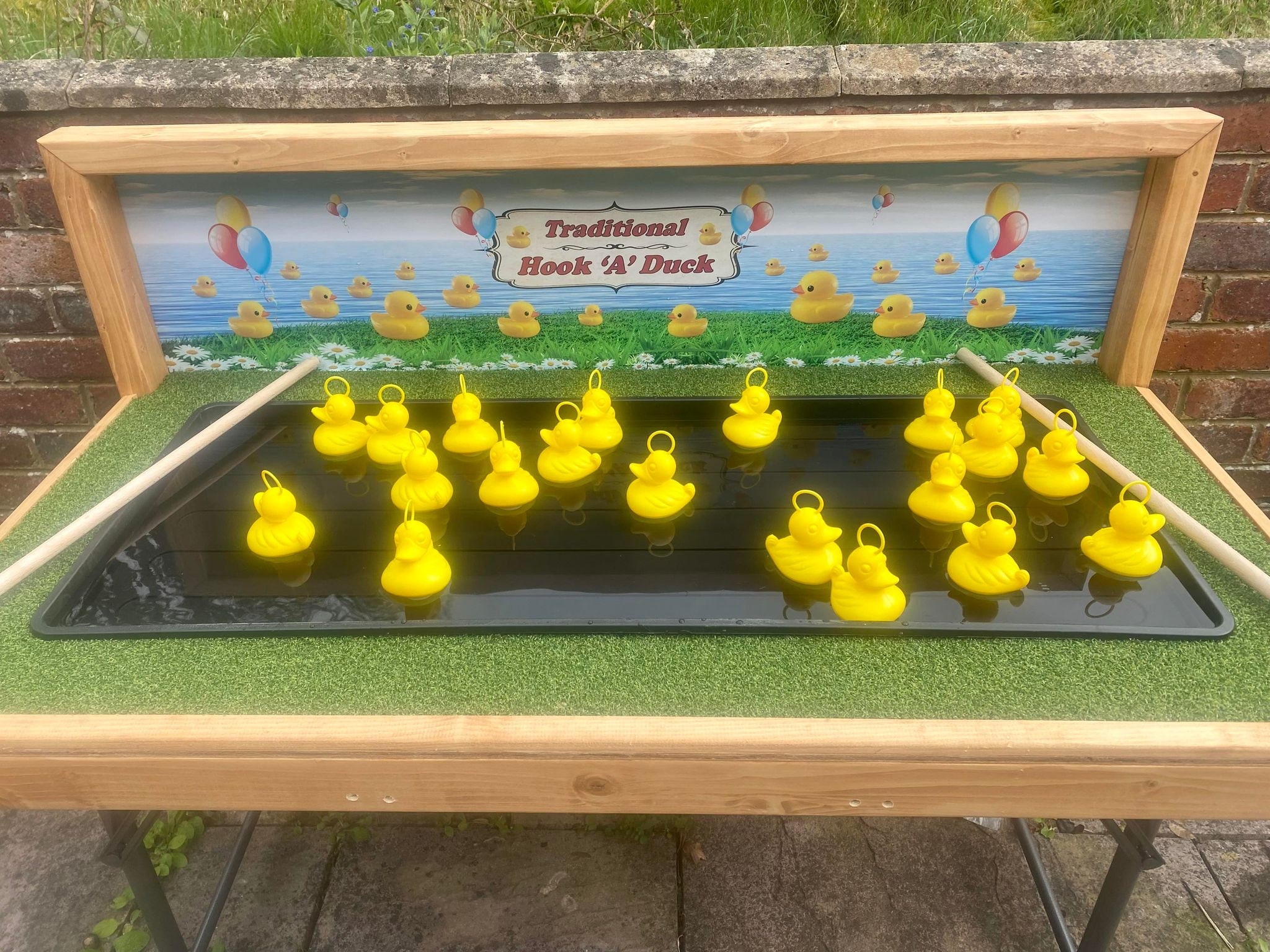 Hook a duck game commercial traditional carnival fete games higher or
