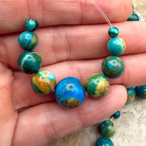 Aaa+ peruvian blue opal graduated round bead focal strand, one focal strand/9 beads