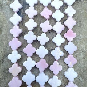 Pink queen conch shell 10mm rounded cross beads (16 inch strand)