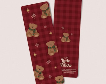 May include: Two rectangular bookmarks with a red and black plaid pattern. Each bookmark features illustrations of brown teddy bears wearing green and red scarves, along with snowflakes and gold stars. The text "Little Willow" is visible.
