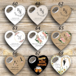 May include: Set of 10 heart-shaped bottle openers with various designs. Some feature floral patterns, others have initials and the text "Thank you for celebrating with us". One has a wedding theme with the text "Ashley & Paul". Another has a beer theme with the text "Cheers! And Beers to 50 Years".