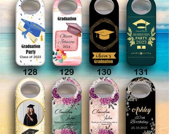 May include: A collection of graduation and birthday-themed bottle openers. Designs include graduation caps, floral arrangements, and personalized text such as "Olivia Johnson 2024" and "Ashley 60th Birthday 25.10.2025". The openers feature a metal bottle opener at the top.
