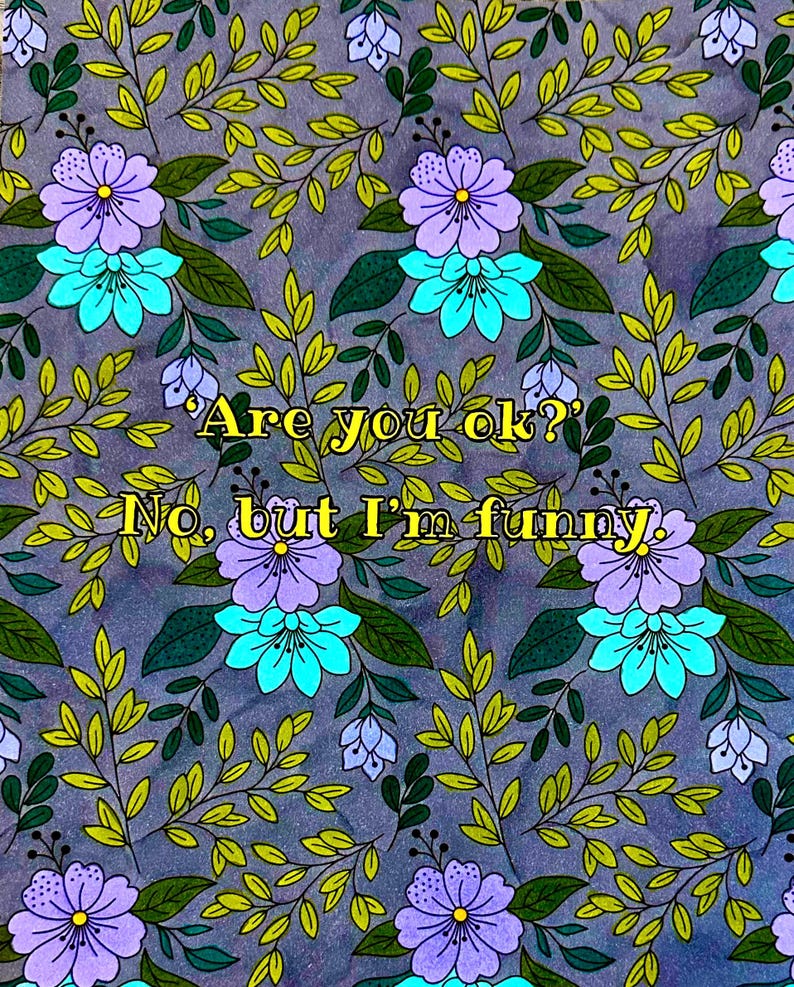 May include: A floral pattern with purple and turquoise flowers, green leaves, and the text "Are you ok? No, but I'm funny." The design is on a gray background.