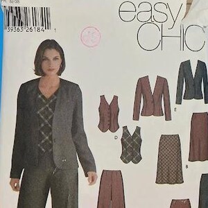 May include: Simplicity Easy Chic sewing pattern featuring a woman in a suit, and various garment options. The pattern includes a jacket, vest, pants, and skirts. The pattern number is 5792, with sizes 4, 6, 8, and 10.