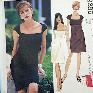 May include: McCall's dressmaking pattern with three dress designs. The cover shows a woman in a black dress. The pattern number is 9396, and the size is E (14, 16, 18). The pattern is petite-able.