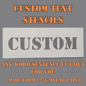 May include: A rectangular white stencil featuring the word CUSTOM cut out in a bold serif font. The image includes the text CUSTOM TEXT STENCILS, ANY WORD/SENTENCE CUT OUT FOR YOU, and MADE FROM 125G MYLAR PAPER in orange lettering against a grey background.