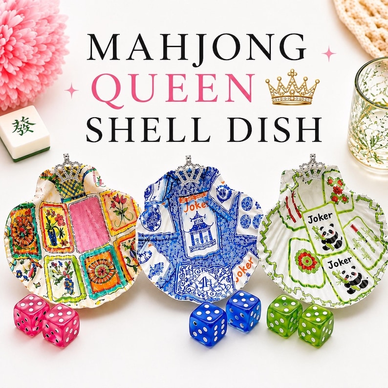 May include: Three decorative shell dishes with crown accents, featuring colorful designs and dice. The dishes are adorned with floral, panda, and pagoda motifs. The text "MAHJONG QUEEN SHELL DISH" is displayed above.