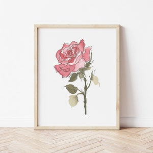 May include: A framed watercolor painting of a single pink rose with green leaves and stem on a white background.