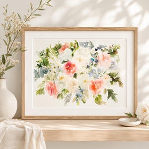 May include: A horizontal rectangular wooden frame containing a watercolor painting of a floral bouquet. The artwork features soft washes of coral, peach, white, and blue flowers interspersed with green foliage on a cream-colored background.